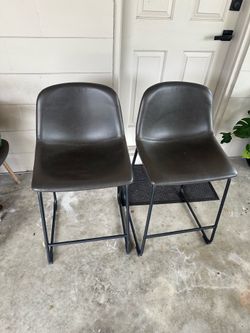 Two gray barstools