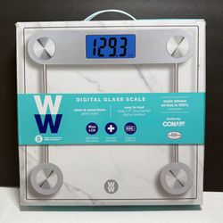 WW Digital Glass Scale - Silver with Blue LCD. Digital glass bathroom scale with silver metal finish. Features a blue backlit LCD display. Slim, moder