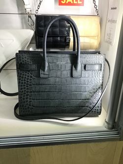 Saint Laurent black crocodile leather purse authenticated