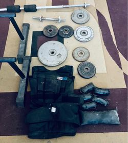 weights / weighted vest / bar / push ups / monkey feet / leg machine / dumbbelss