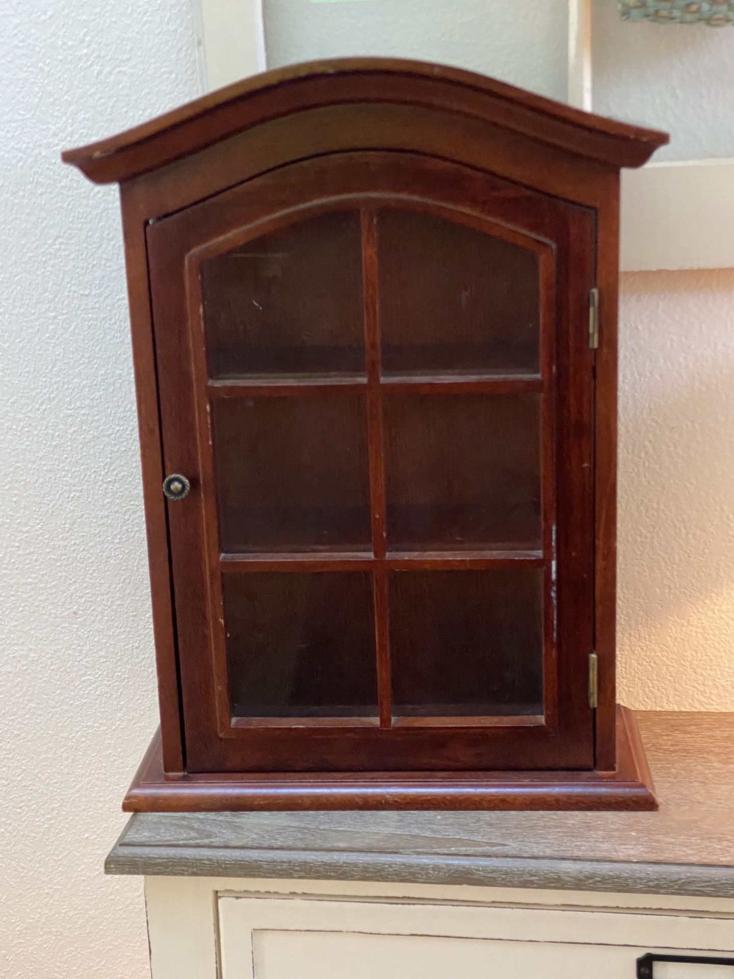 wood armoire with glass door