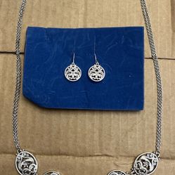  Silver toned necklace and earring set.