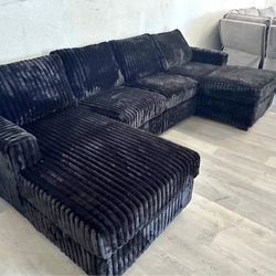 Black Jumbo corduroy sectional sofa with double chaise