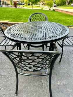 Patio set, table with 4 chairs and 4 newer cushions, delivery available if needed for extra cost