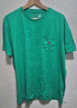 Polo Ralph Lauren t-shirt, vibrant green fabric and a contrasting embroidered logo on the chest pocket.Brand: Polo Ralph LaurenColor: Green, likely a 