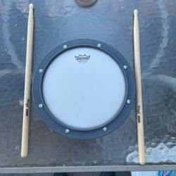 Remo 8 inch drum practice pad with stag drumsticks