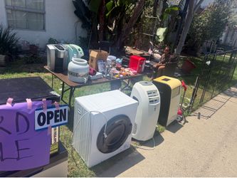 Kids running a  yard sale