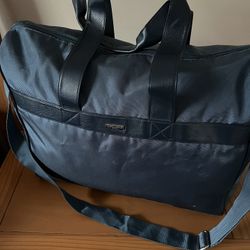 It’s Very Good Duffle Bag Made By GORGIO Armani. The Color Is Teal.