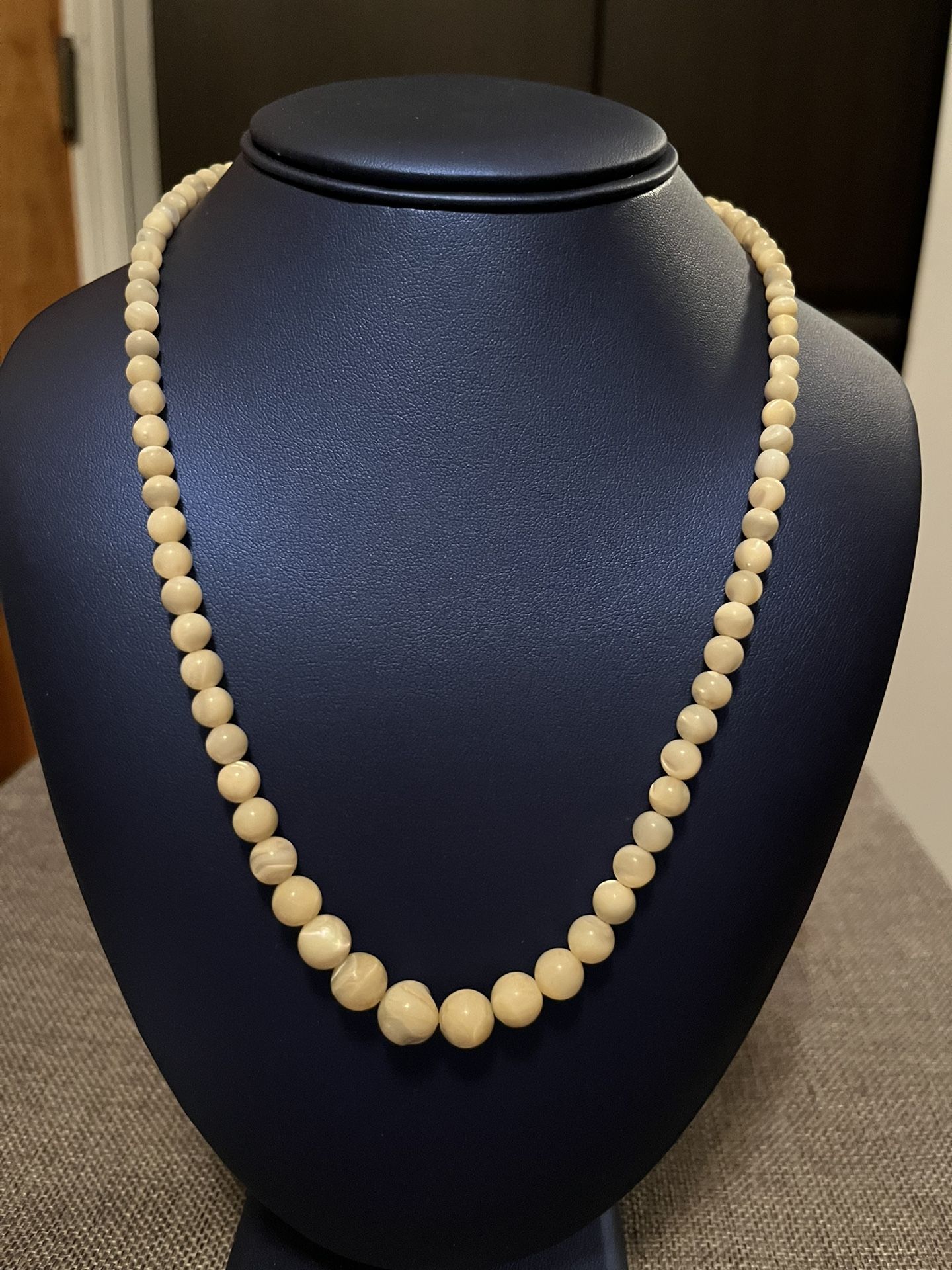 Shell beaded Pearl necklace. Very pretty. From clasp to clasp is about 20”.(salt water pearl). In good condition 