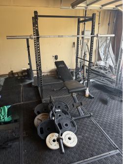 Bench press/squat rack with 7ft 45lbs bar plus 250lbs of Olympic weights and curl bar