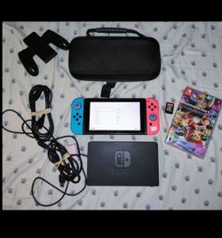 Nintendo switch bundle with brand new joycons. 2 games and 64gb Microsd card.
