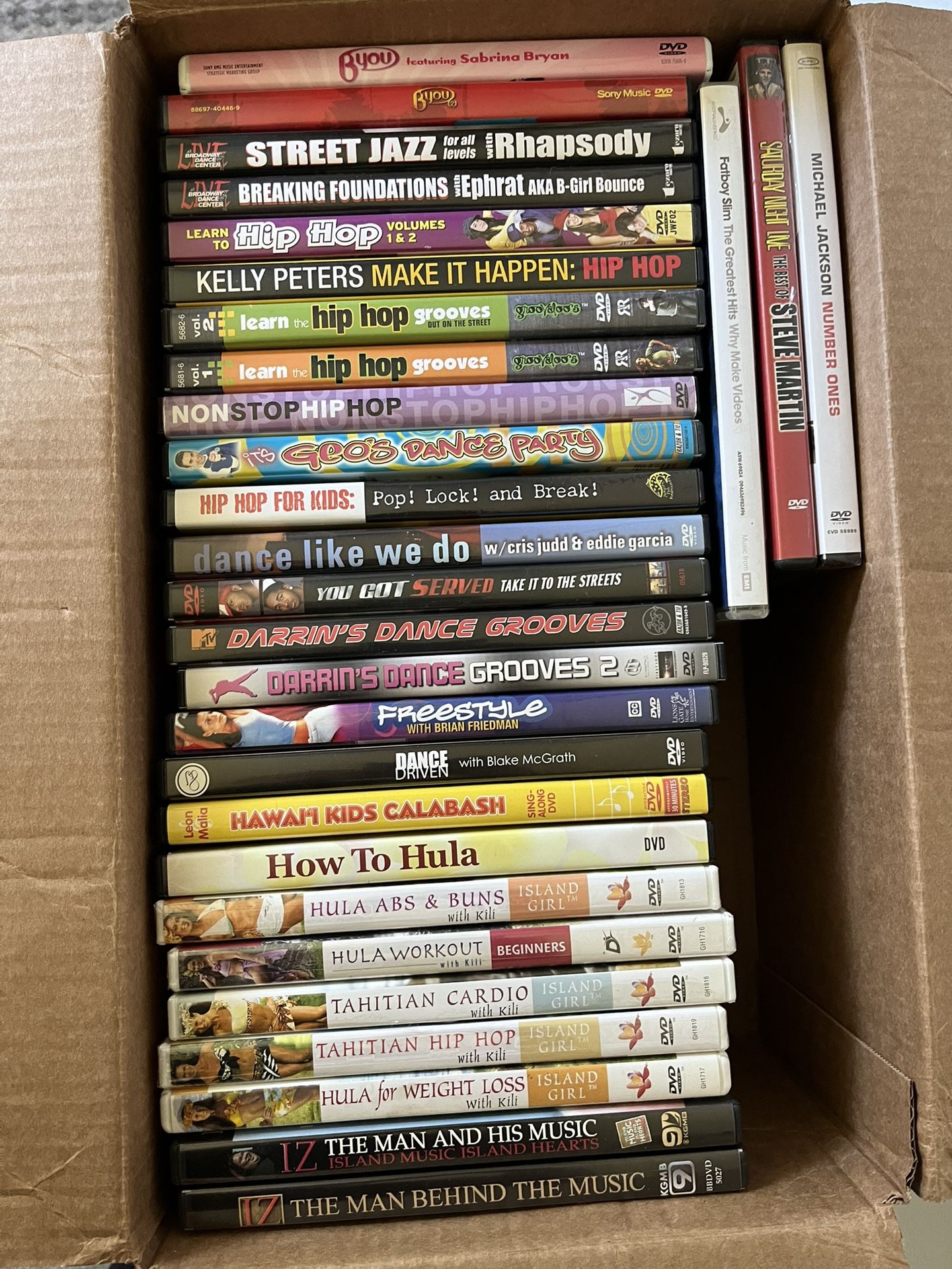 Box of instructional dance DVDs
