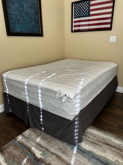Full size boxspring and metal frame. Full-size mattress cover, and bed skirt included.