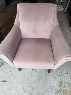 Mauve velvet wingback armchair