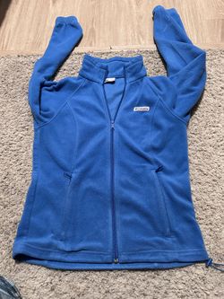 Woman’s bright blue Columbia zip up fleece.