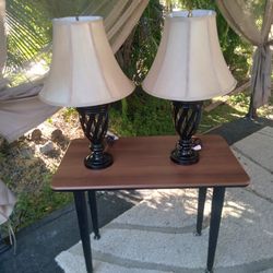 2 Lamps And A Table 