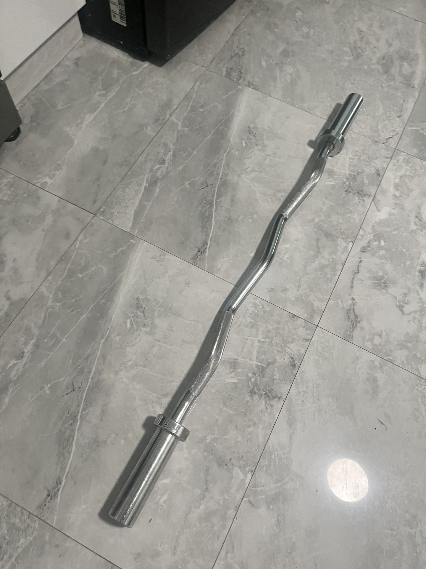 Brand new in wrapper ez curl barbell bar for Olympic weights plates for 2 inch slot of weights also have Olympic 45s new in box for additional price