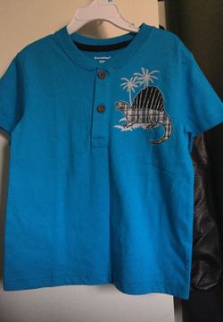 Aqua color blue shirt with a dinosaur size 5t