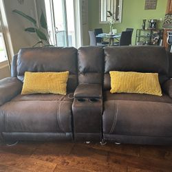 Dual electronic Leather Recliners. 