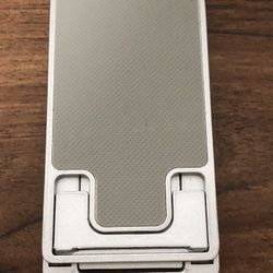 Foldable and retractable mobile phone holder