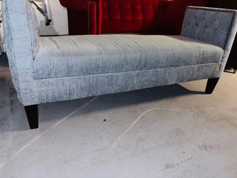 Light blue tufted sitting bench entry end of bed bench