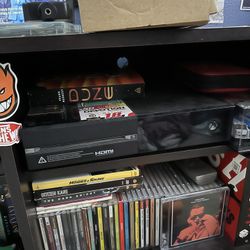 X-box one and 2 controllers