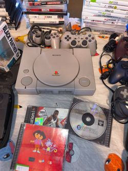 Sony PlayStation 1 Console with Controllers and Games