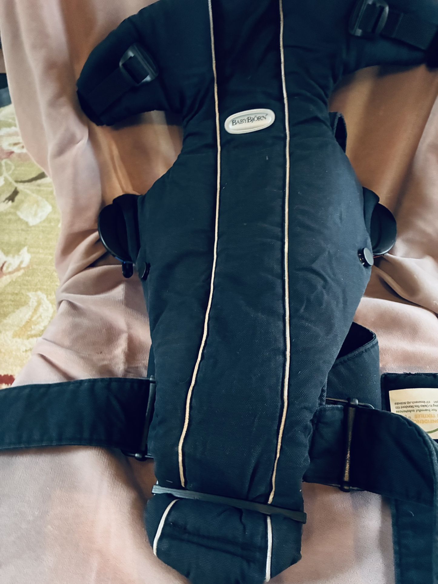 Black BabyBjörn baby carrier in good condition.