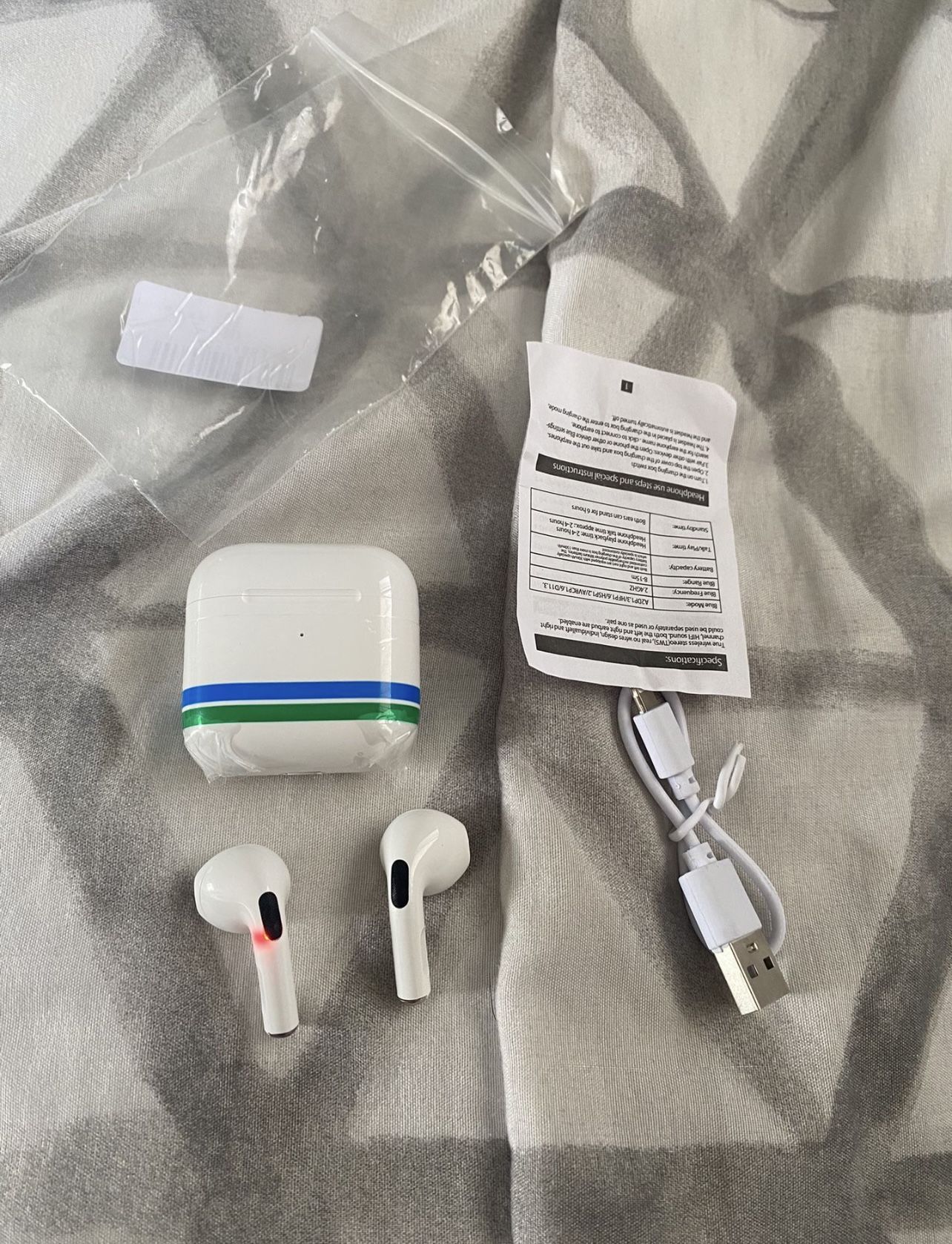 New wireless earbuds. with charger.