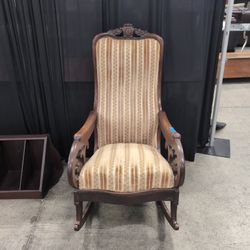 Ornate Carved Wood Upholstered Armchair with Floral Stripes