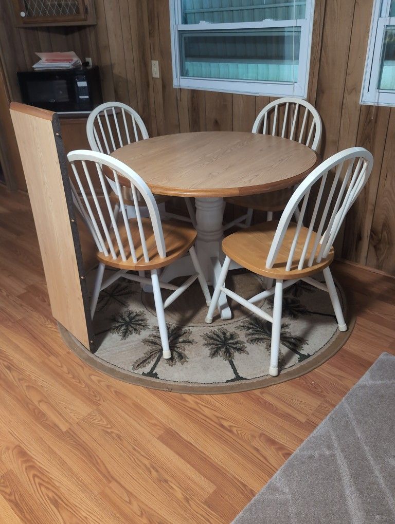 Table And Four Chairs And Rug