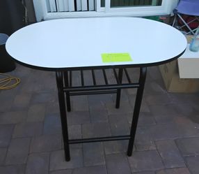 Oval Dining Table with White Top and Black Metal Frame