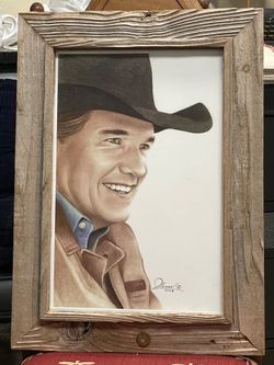 Rustic Wood Frame w/ bullets, 16” W x 22” H. Picture of country singer George Strait
