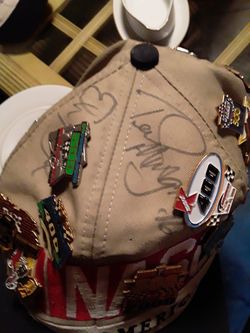 Signed nascar hat wiht alot of pins