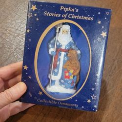 Pipka’s Stories Of Christmas Collectible Ornament 11421 Russian Santa 
New in the box  . Approximately 4" tall. UPC 17.
Weight 4oz plus ship