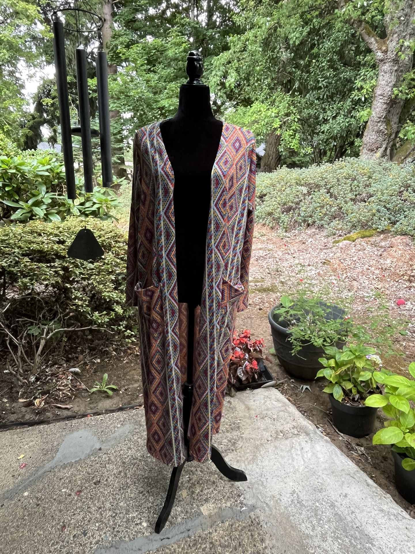 PENDING.  Colorful, light weight, long jacket/cardigan with POCKETS! Size medium.