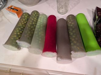 Paintballs with holding canisters