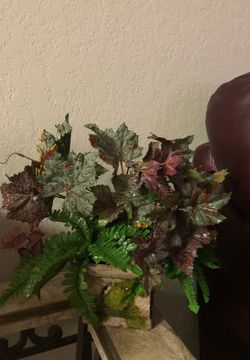 Small artificial arrangement with moss look vase