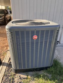 Rheem central air conditioner outdoor condenser unit.