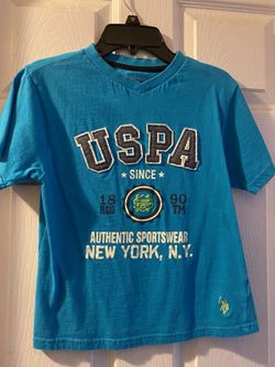 Nice shirt size 8 😊 The brand is U.S. POLO ASSN