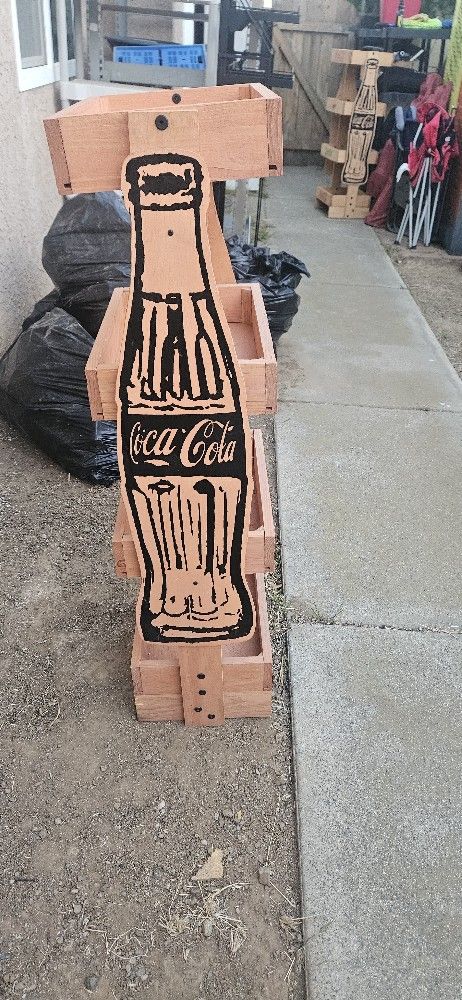 2 wooden Coke shelves.