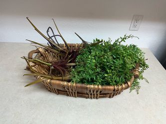 Decorative basket with plastic flowers/brush