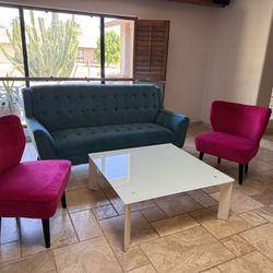 Two Pink Fuchsia Velvet Chairs & Turquoise Blue Couch & Frosted Glass Table