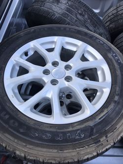 Like new jeep wheels and tires