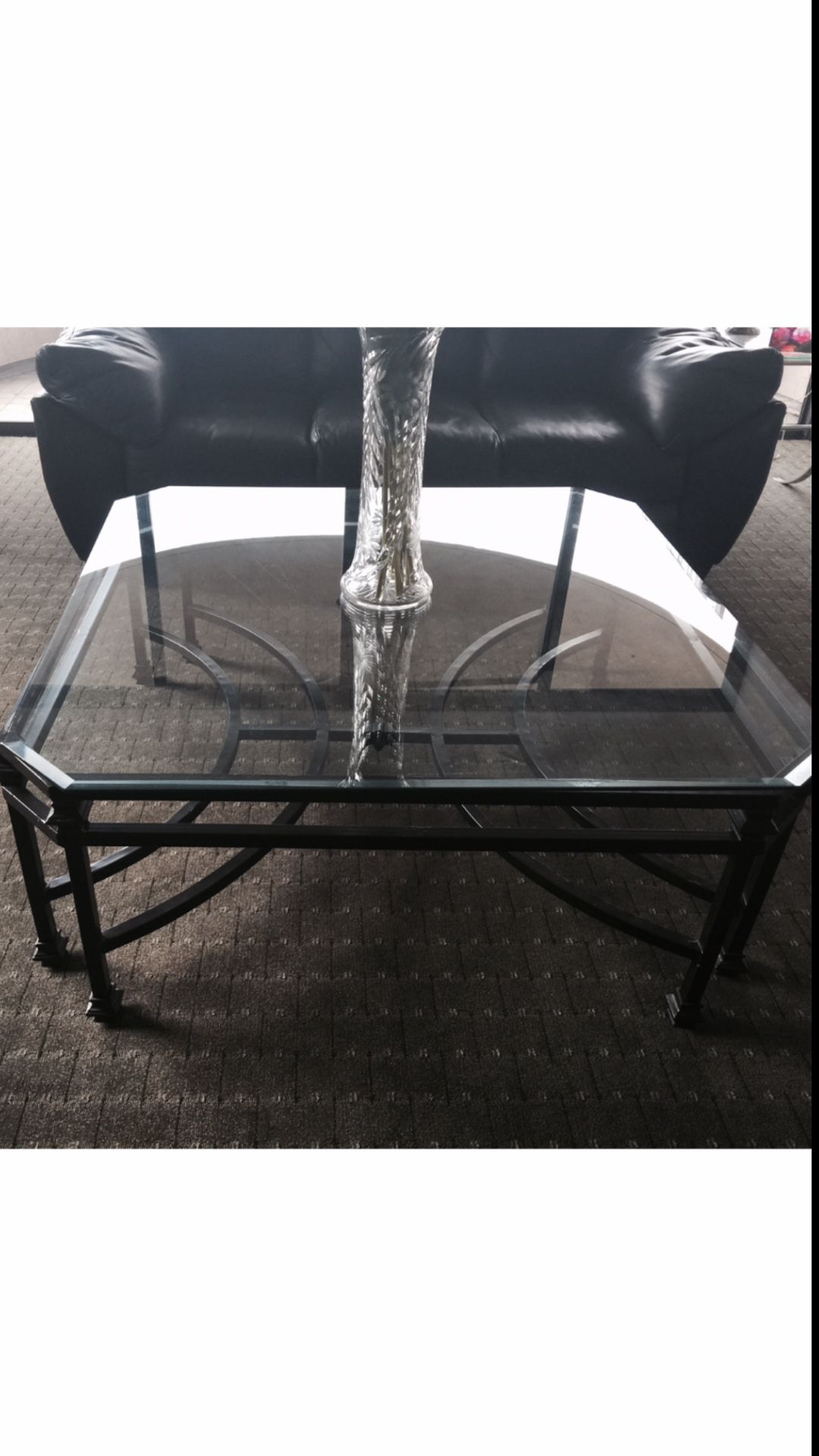 Black Wrought Iron Coffee table with glass top. Small crack in corner