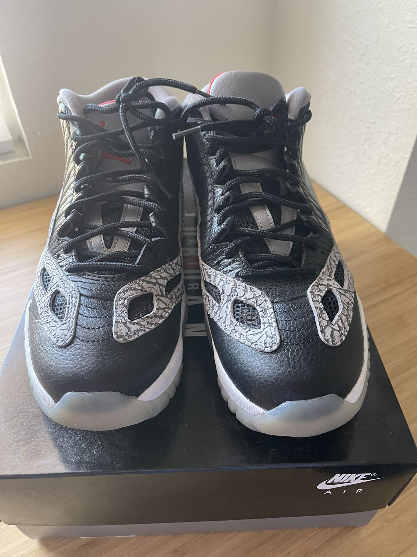 Jordan 11 Low IE Black Cement