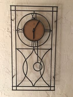 Wall clock 10 inches wide 19 inches tall