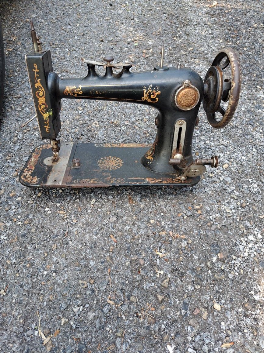 Antique sewing machine and 22 vintage sewing patterns from mostly from the 60's, 70's and 80's