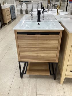 24” bathroom vanity cabinet new wood color with ceramic top Softclose doors ready for pick up today