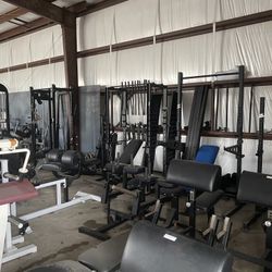 Lots Of Squat Racks And Fitness Equipment